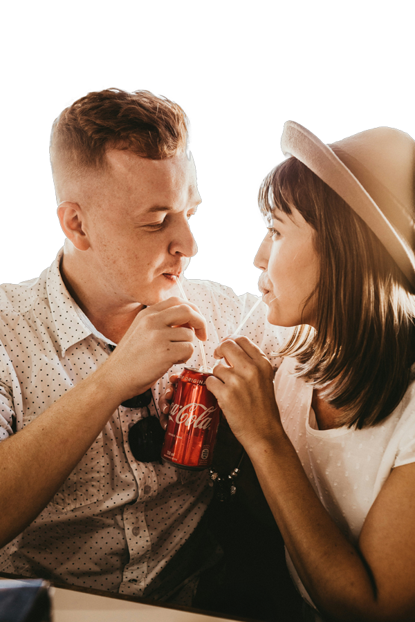 Couple enjoying a refreshing Coca-Cola®
